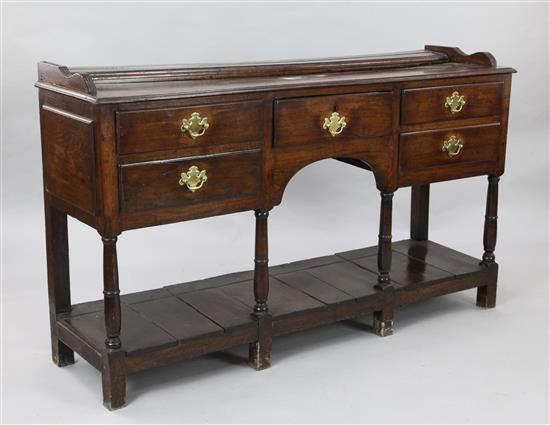 An early 19th century oak dresser base, W.5ft D.1ft 5in. H.2ft 11in.